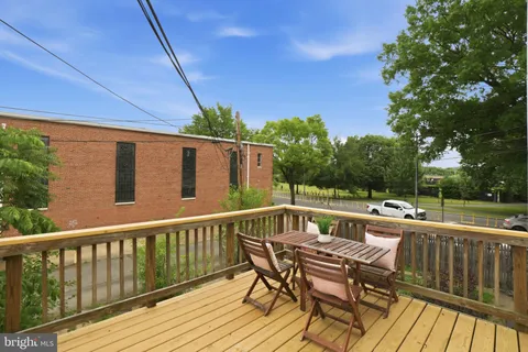 a view of a patio with wooden floor