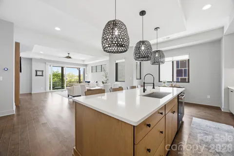 a very nice looking dining room with furniture window and wooden floor