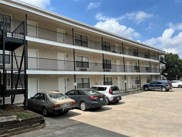 a cars parked in front of a building