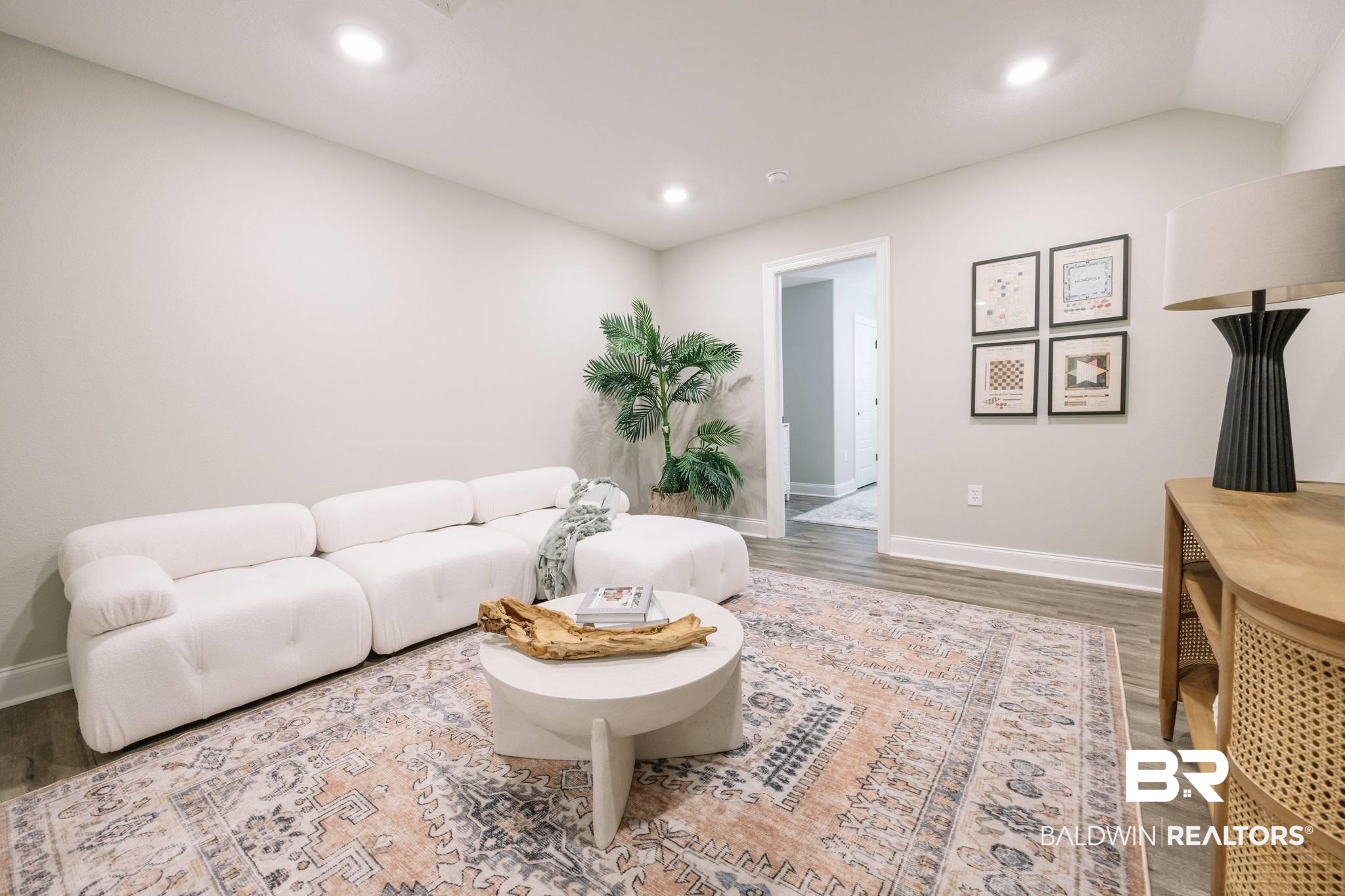 12918 Flanagan Street Elberta, AL 36530 - Photo 12 of 33 Open-concept room featuring recessed lighting, light-toned walls, and wood-finish flooring