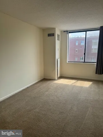 a view of an empty room with a window