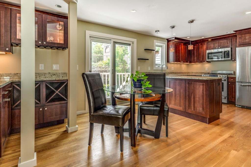 35 Perry Street, Unit 35 Somerville, MA 02143 - Photo 2 of 9 a view of a dining room with furniture window and wooden floor