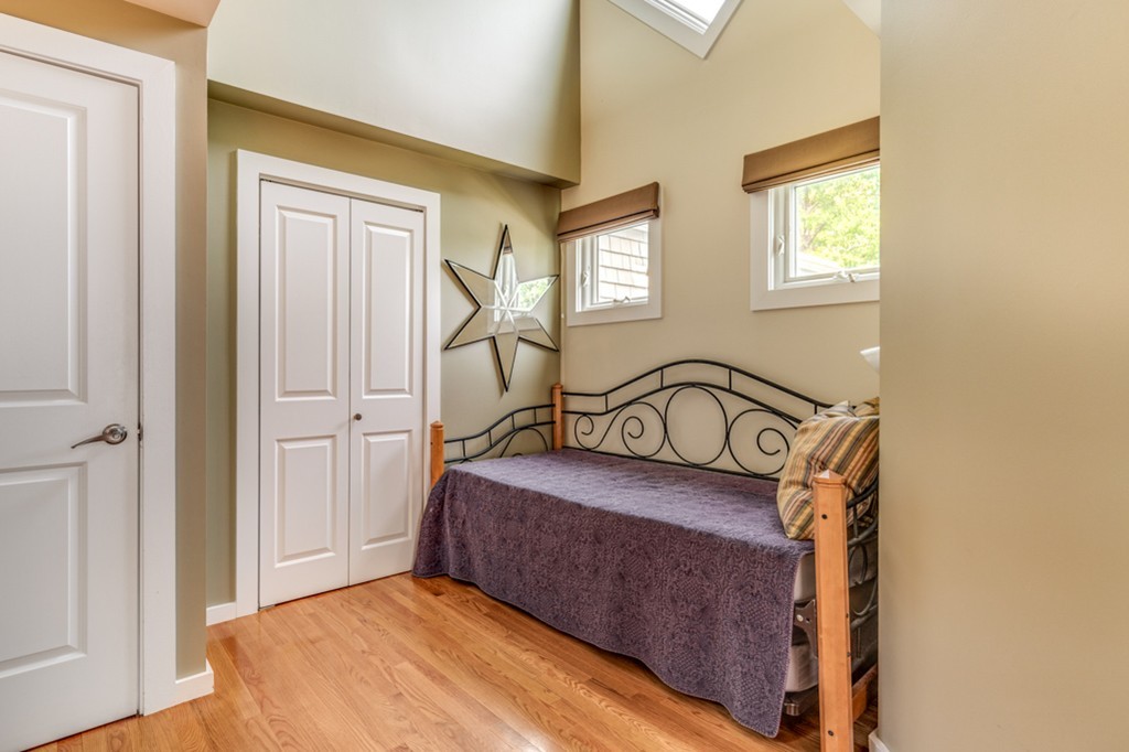 35 Perry Street, Unit 35 Somerville, MA 02143 - Photo 6 of 9 a bedroom with a bed and a window