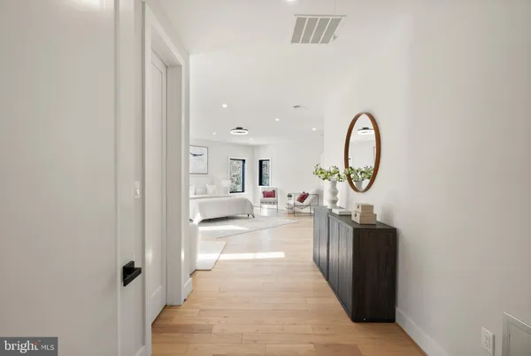 a bathroom with a sink vanity granite toilet and a shower