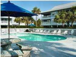 3799 Hwy Santa Rosa Beach, Unit 14H 30A Santa Rosa Beach, FL 32459 - Photo 2 of 7 a front view of a house having yard