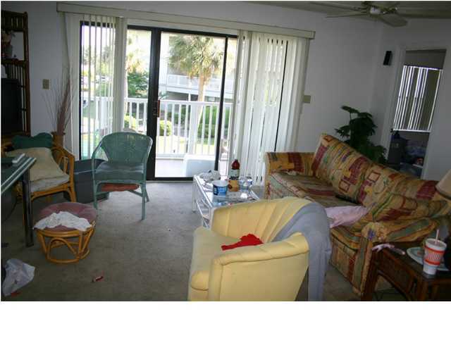 3799 Hwy Santa Rosa Beach, Unit 14H 30A Santa Rosa Beach, FL 32459 - Photo 6 of 7 a living room with furniture and a flat screen tv
