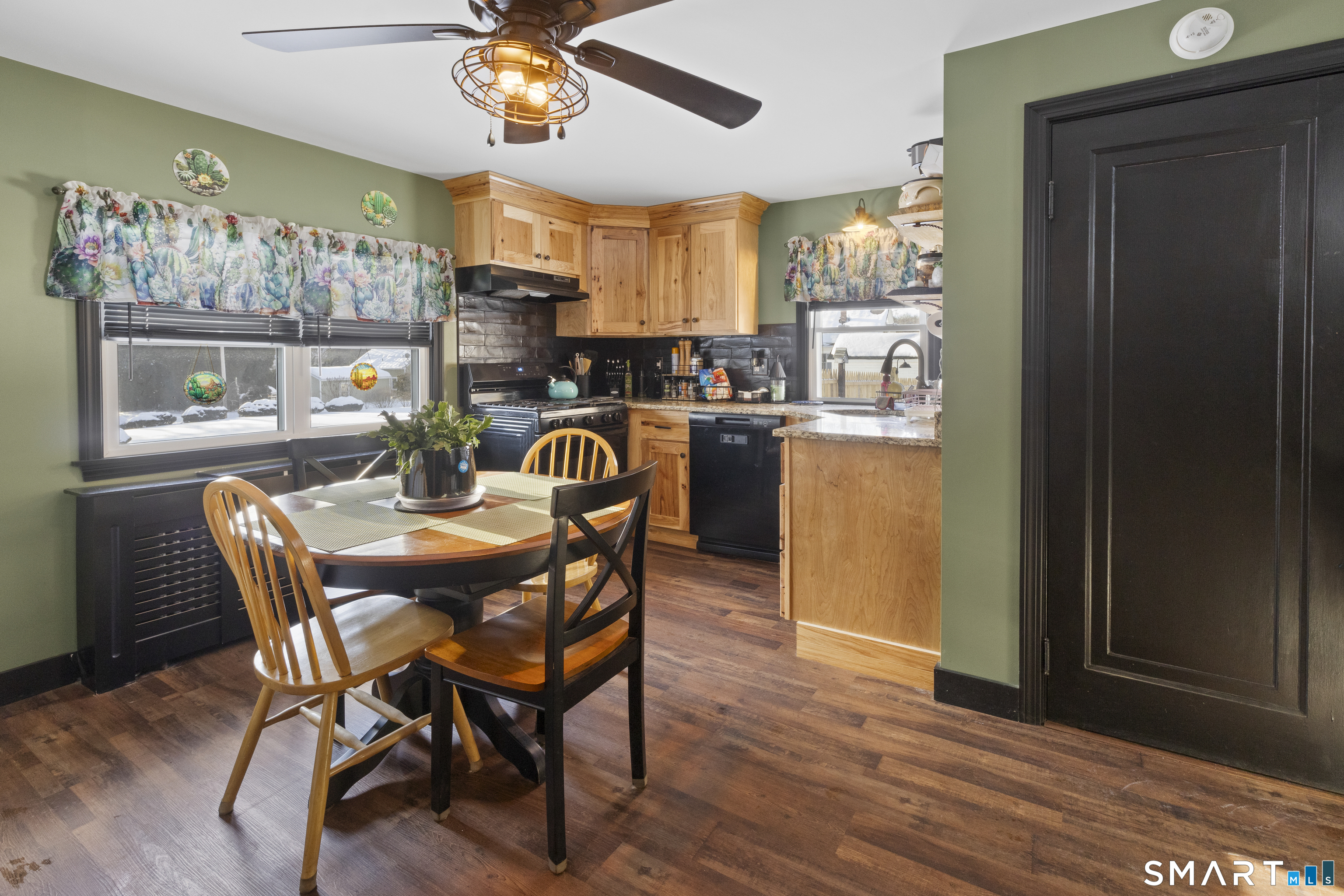 17 Auburn Street Putnam, CT 06260 - Photo 3 of 9 a dining room with furniture a kitchen and chandelier