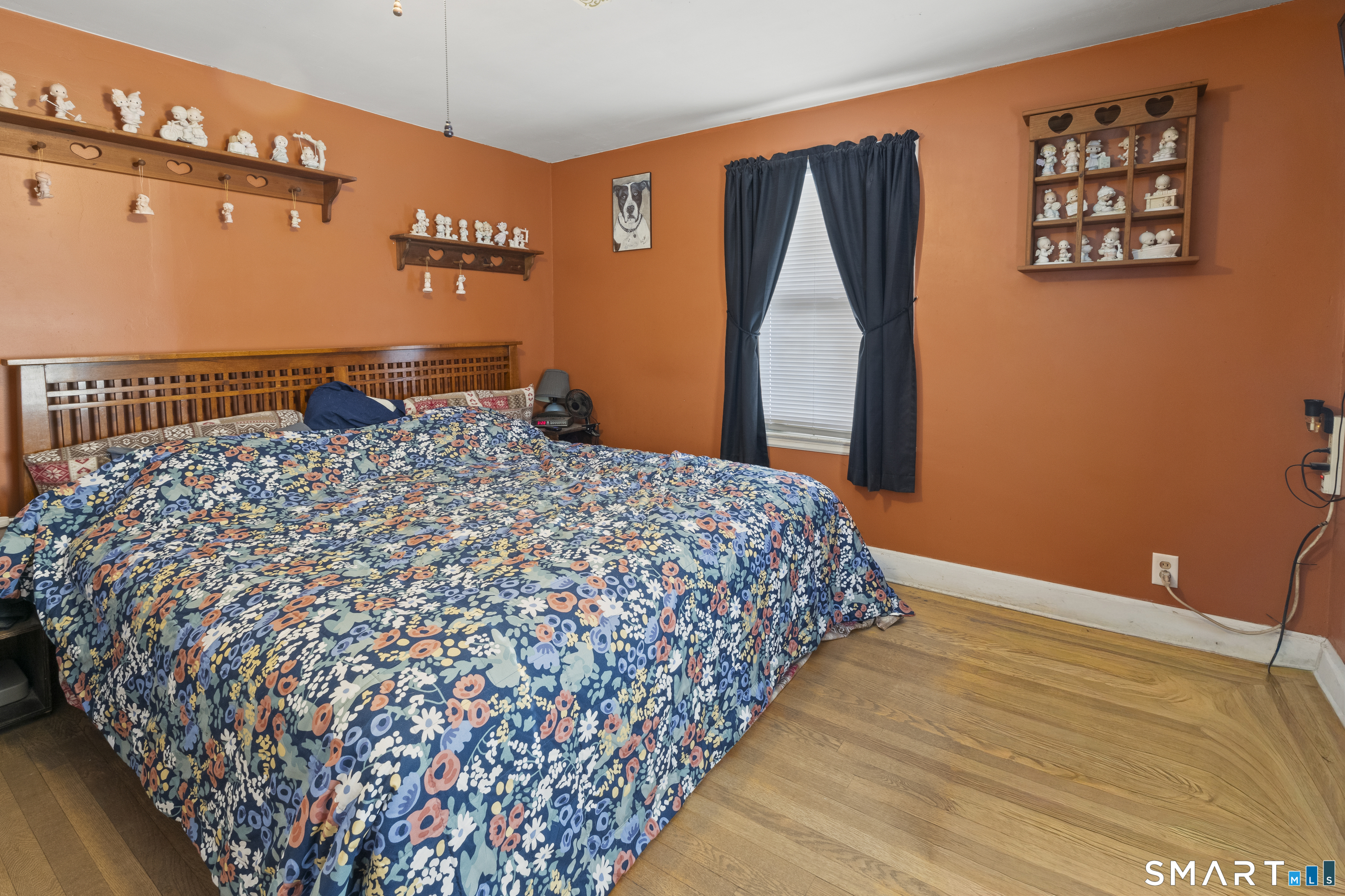 17 Auburn Street Putnam, CT 06260 - Photo 7 of 9 a large bed sitting in a bedroom next to a window