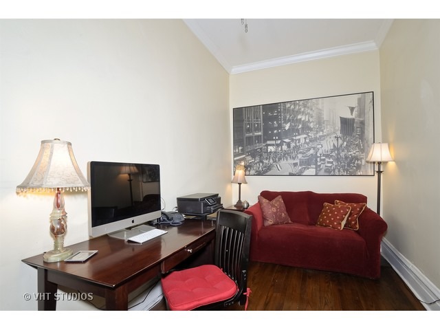 2157 North Seminary Avenue, Unit A Chicago, IL 60614 - Photo 11 of 15 a living room with a couch and a flat screen tv