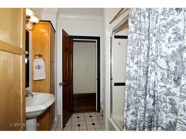 2157 North Seminary Avenue, Unit A Chicago, IL 60614 - Photo 13 of 15 a bathroom with a sink and mirror