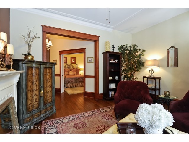 2157 North Seminary Avenue, Unit A Chicago, IL 60614 - Photo 3 of 15 a living room with furniture rug and a fireplace