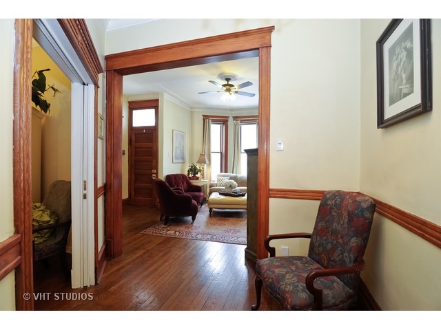 2157 North Seminary Avenue, Unit A Chicago, IL 60614 - Photo 5 of 15 a view of living room and kitchen with furniture and wooden floor
