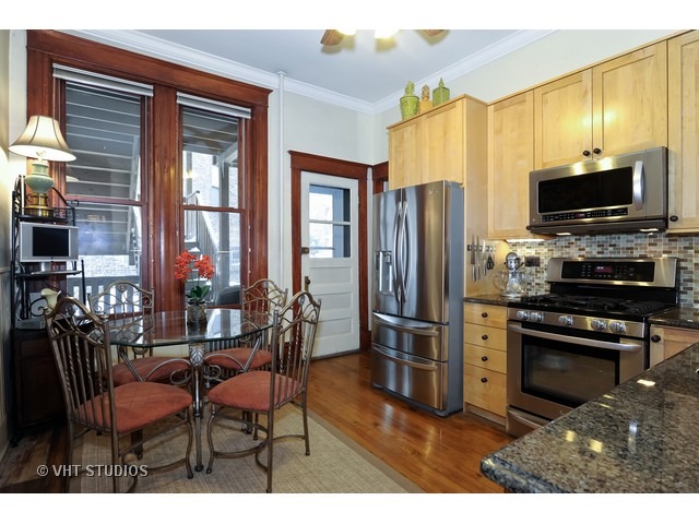 2157 North Seminary Avenue, Unit A Chicago, IL 60614 - Photo 7 of 15 a kitchen with stainless steel appliances a refrigerator and a stove top oven