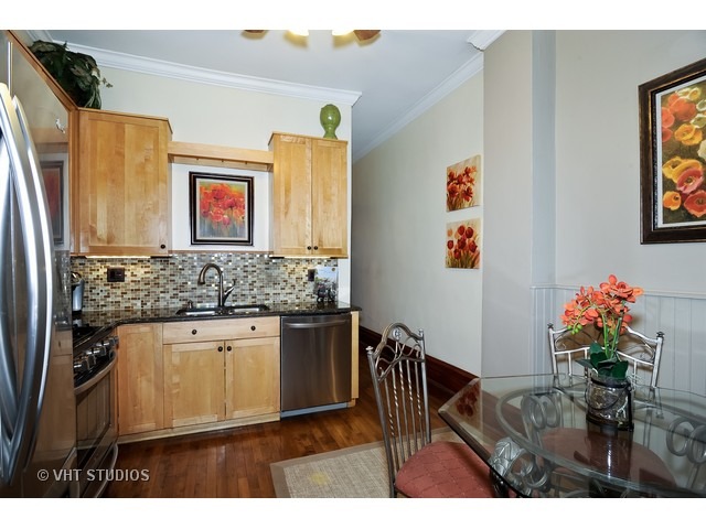 2157 North Seminary Avenue, Unit A Chicago, IL 60614 - Photo 8 of 15 a kitchen with stainless steel appliances granite countertop a refrigerator and a sink