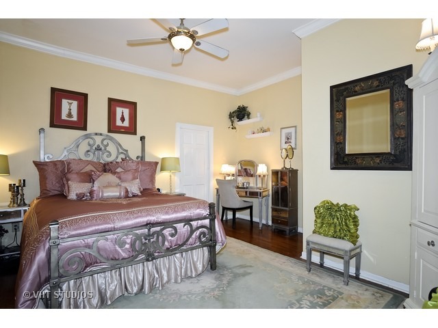 2157 North Seminary Avenue, Unit A Chicago, IL 60614 - Photo 9 of 15 a bedroom with a bed mirror and window
