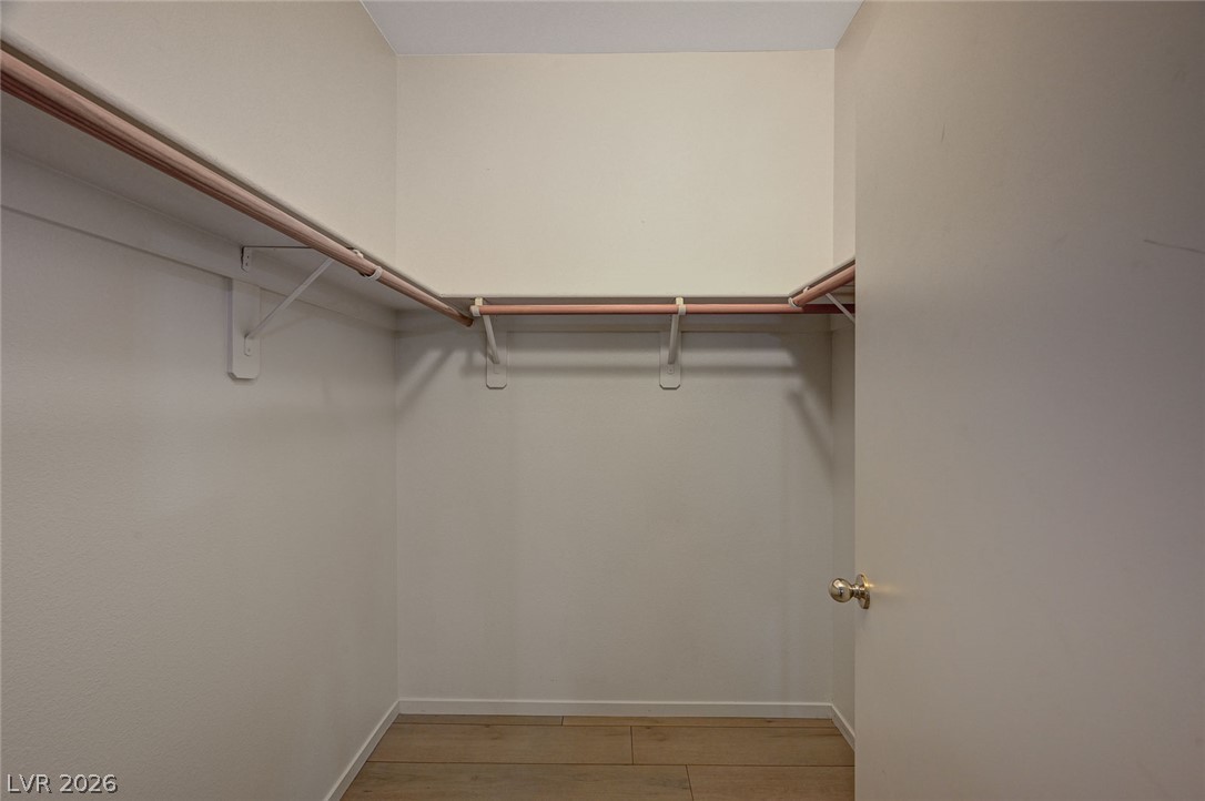 9050 West Warm Springs Road, Unit 1147 Las Vegas, NV 89148 - Photo 26 of 36 Ample hanging space and shelving create an organized storage solution.