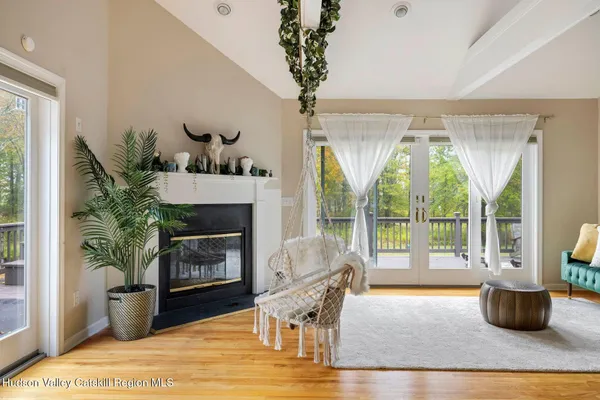 a living room with a couch and a potted plant
