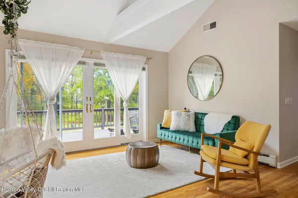 a kitchen with stainless steel appliances granite countertop a refrigerator a stove top oven and a sink