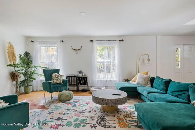 a kitchen with kitchen island granite countertop a sink stove and refrigerator