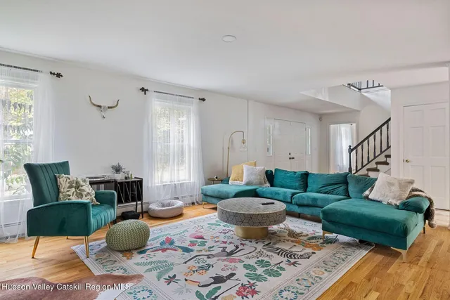 a kitchen with a stove a sink and a window