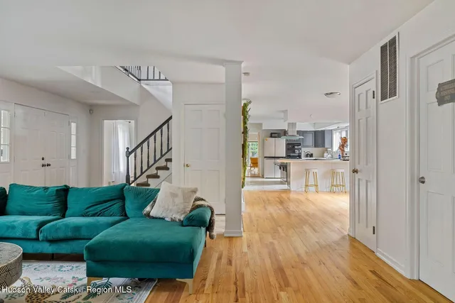 a kitchen with a sink a window and cabinets