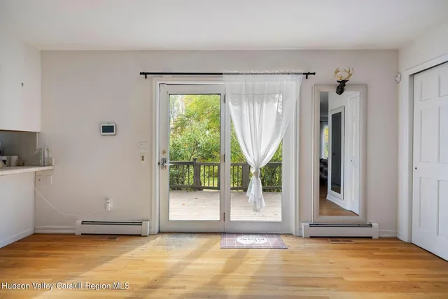a view of a dining room with furniture and window