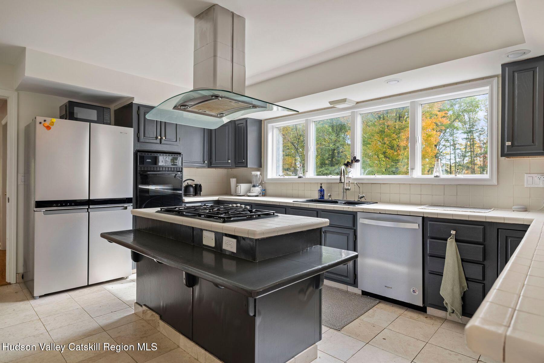2935 Rte 44 55 Gardiner, NY 12525 - Photo 25 of 87 a kitchen with a stove a sink and a refrigerator