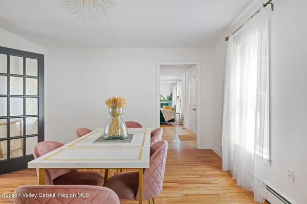 a en suite bathroom with a granite countertop sink and a mirror