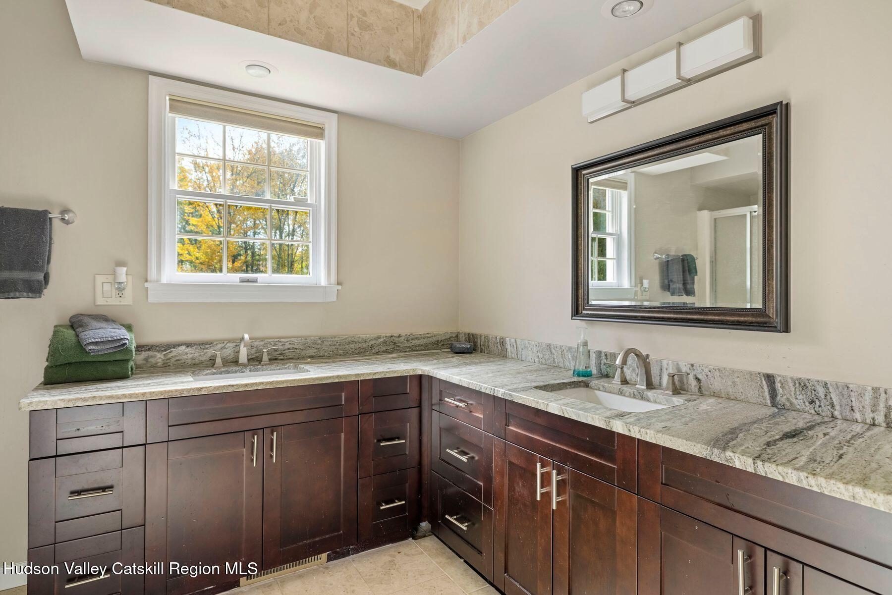 2935 Rte 44 55 Gardiner, NY 12525 - Photo 40 of 87 a bathroom with a granite countertop sink a mirror and a window