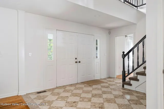 a house view with a sitting space and garden
