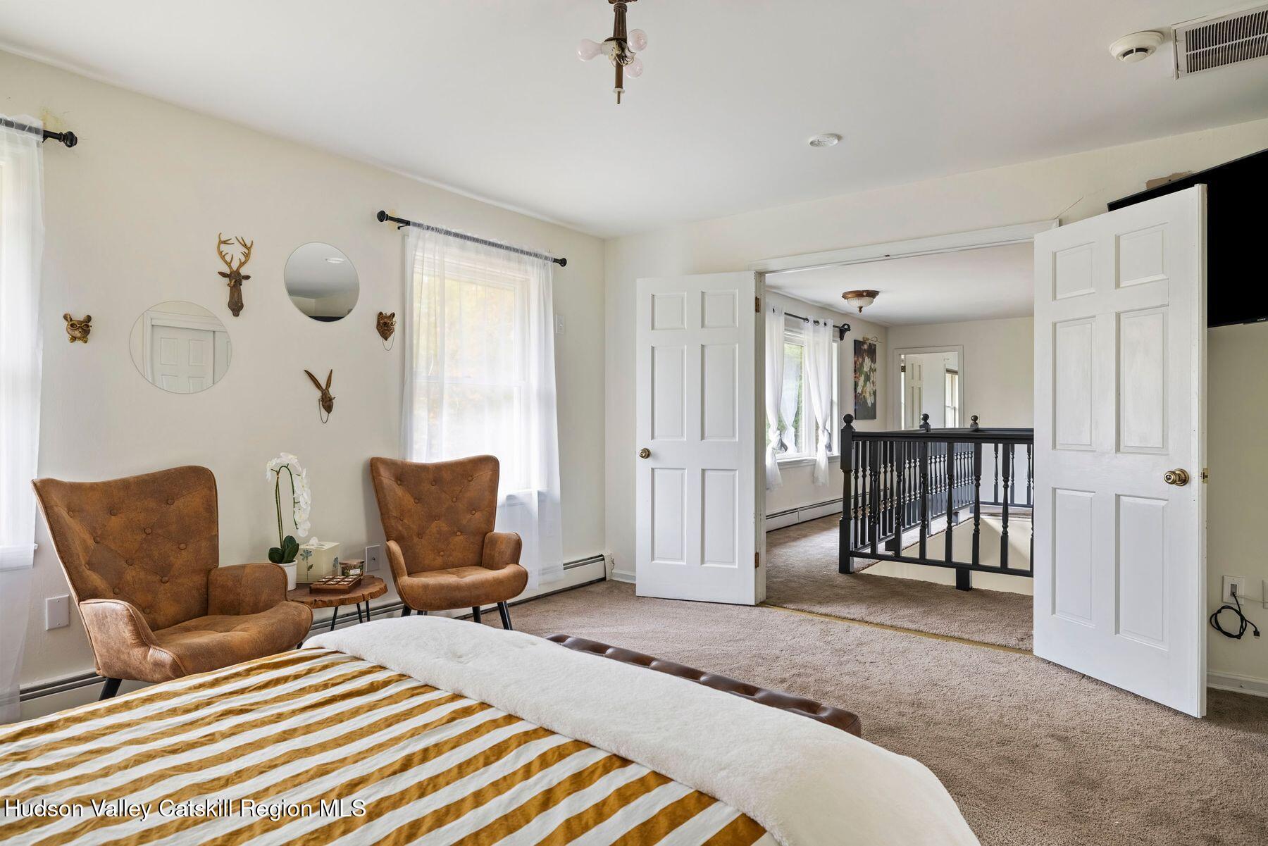 2935 Rte 44 55 Gardiner, NY 12525 - Photo 45 of 87 a bedroom with furniture and a chair