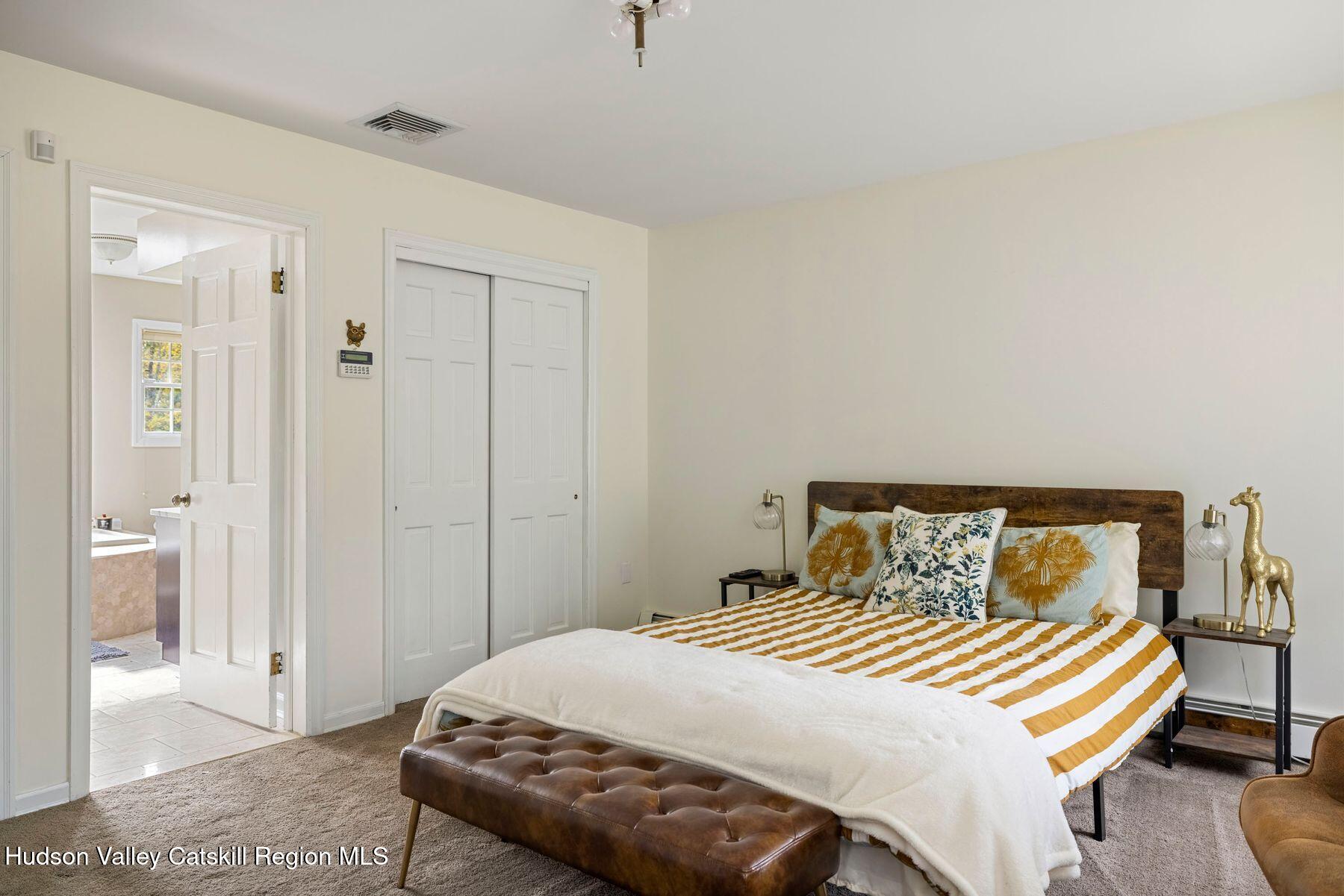 2935 Rte 44 55 Gardiner, NY 12525 - Photo 46 of 87 a bedroom with a bed and wooden floor