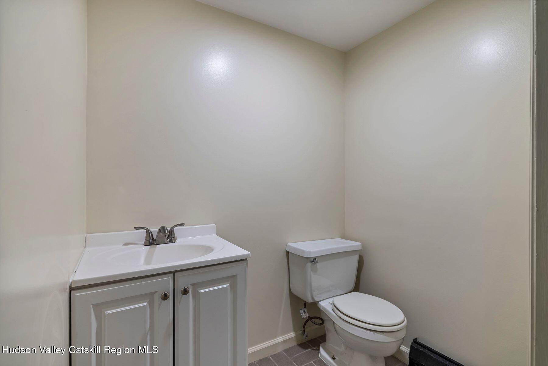 2935 Rte 44 55 Gardiner, NY 12525 - Photo 61 of 87 a bathroom with a sink a toilet and a mirror