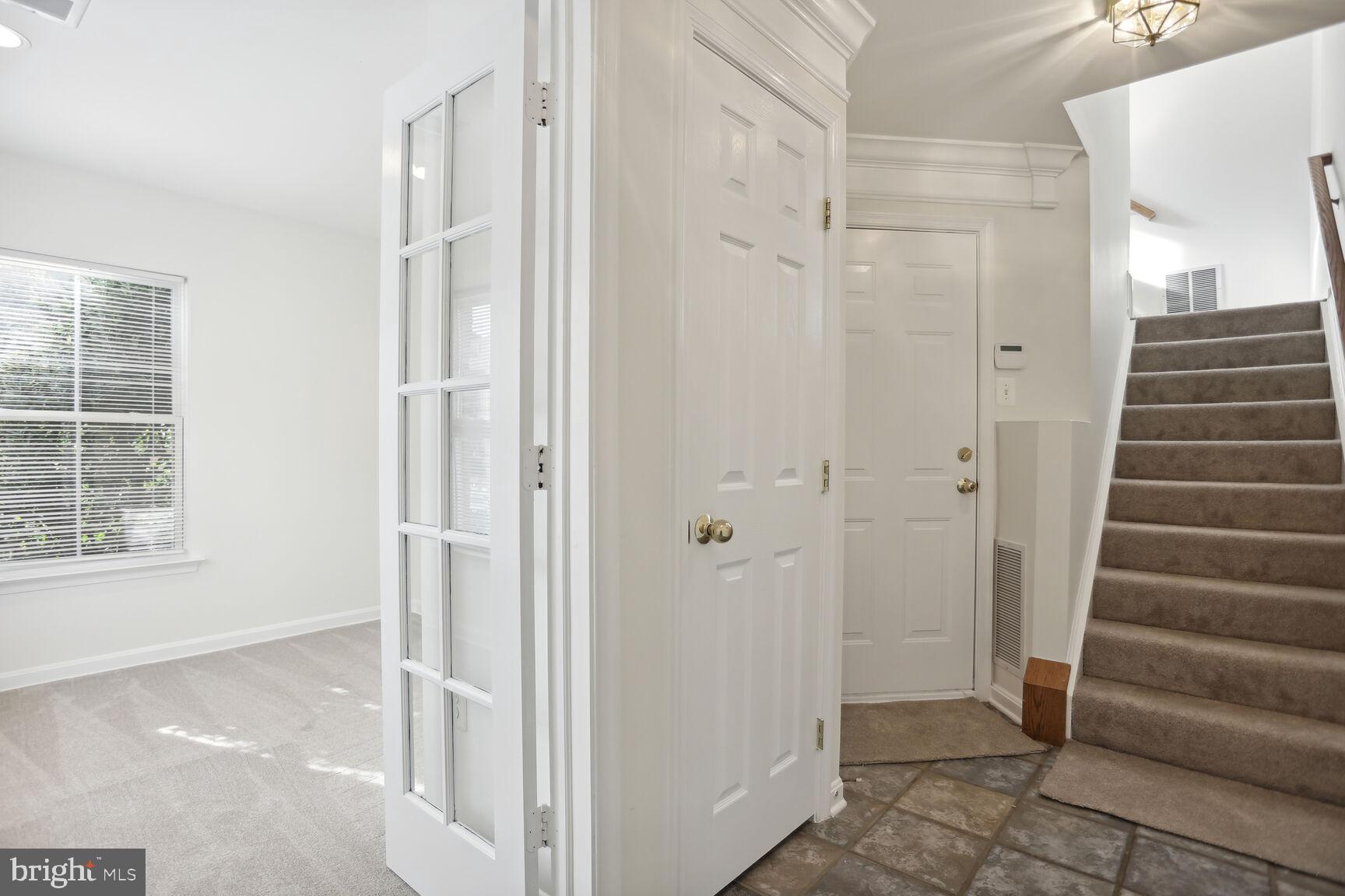 5133 Gardner Drive Alexandria, VA 22304 - Photo 17 of 25 a view of an entryway with wooden floor and windows