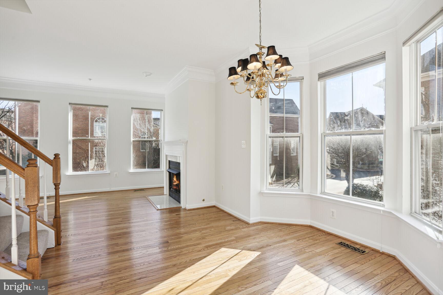 5133 Gardner Drive Alexandria, VA 22304 - Photo 2 of 25 a view of an empty room with wooden floor and a window