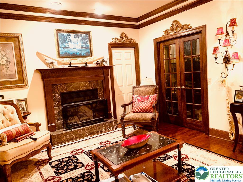 459 Mt Pleasant Road Bangor, PA 18013 - Photo 16 of 86 a living room with furniture a flat screen tv and a fireplace