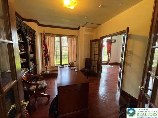a bedroom with furniture window and wooden floor