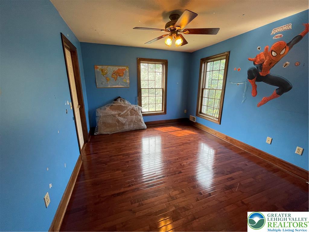 459 Mt Pleasant Road Bangor, PA 18013 - Photo 63 of 86 a view of an empty room with window and wooden floor