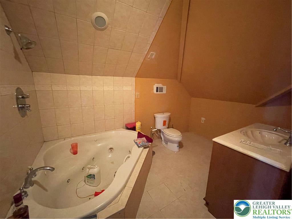 459 Mt Pleasant Road Bangor, PA 18013 - Photo 83 of 86 a bathroom with a tub sink and a mirror