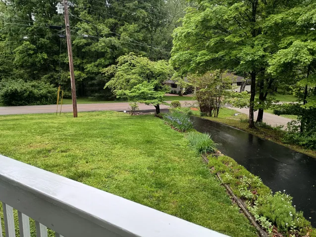 a view of a lake with a yard