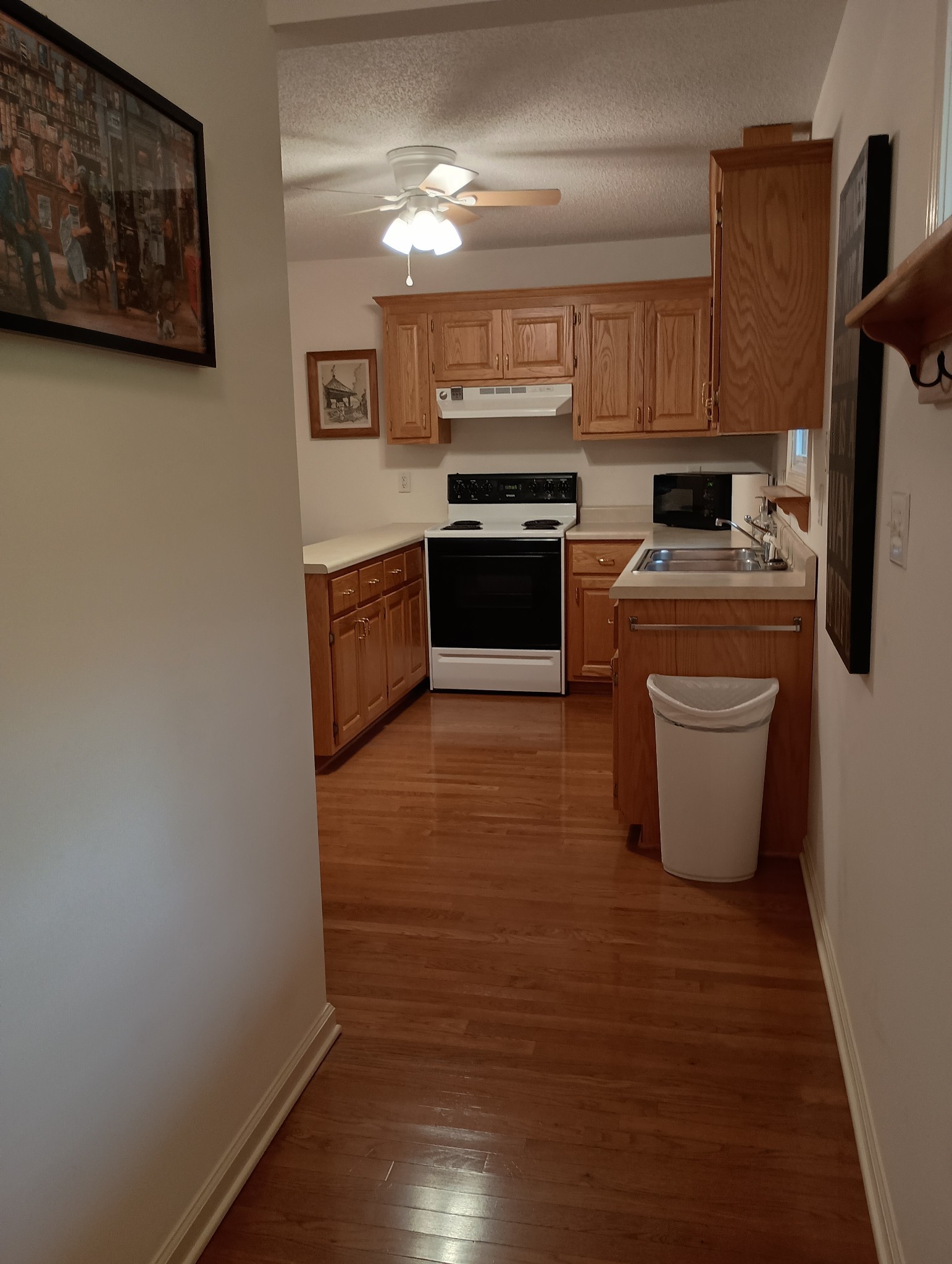 161 Kentucky Avenue Sewanee, TN 37375 - Photo 6 of 12 a kitchen with stainless steel appliances granite countertop a stove a sink and a refrigerator