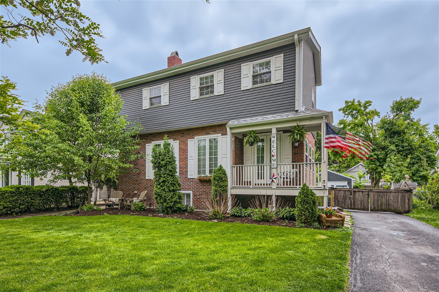 249 Herrick Road Riverside, IL 60546 - Photo 3 of 27 a front view of house with yard and green space