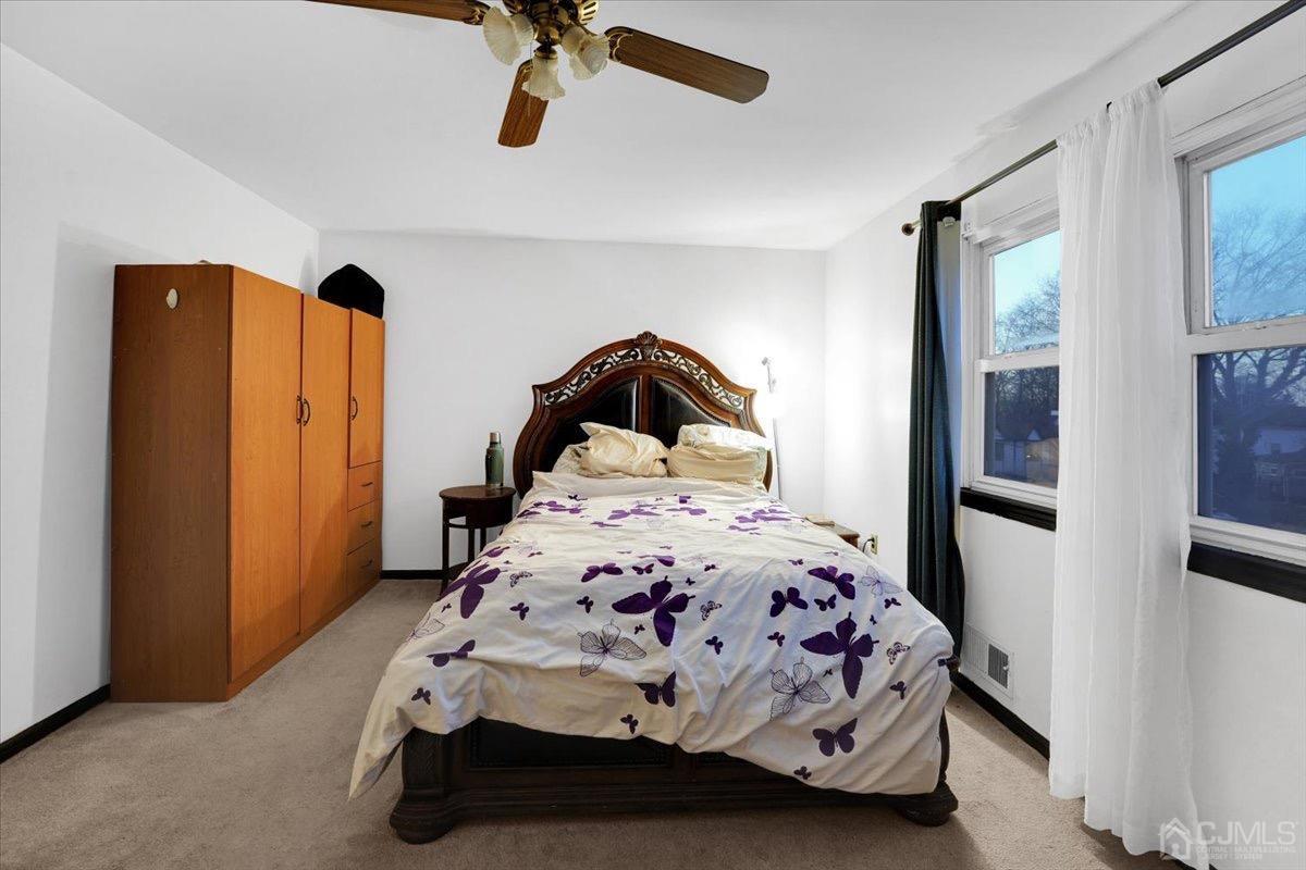 145 Jefferson Boulevard Edison, NJ 08817 - Photo 18 of 35 a bedroom with a bed and large mirror