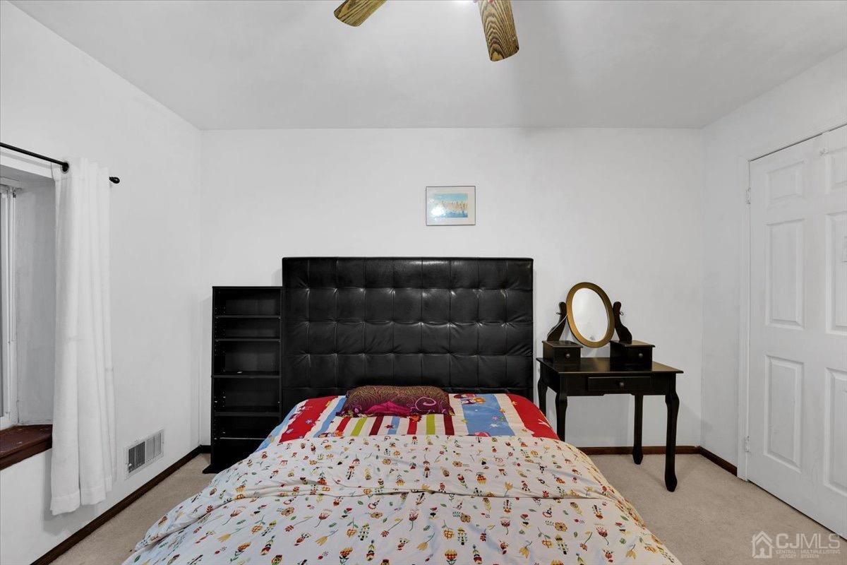 145 Jefferson Boulevard Edison, NJ 08817 - Photo 20 of 35 a bedroom with a bed and a window
