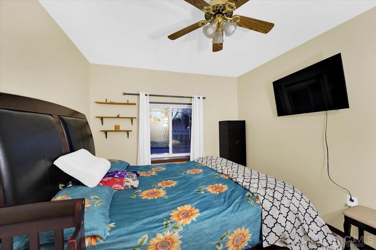 145 Jefferson Boulevard Edison, NJ 08817 - Photo 23 of 35 a living room with furniture and a flat screen tv