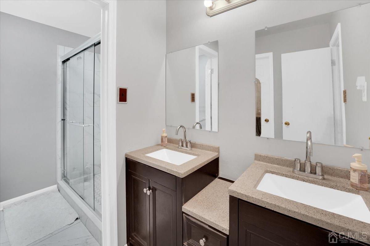 145 Jefferson Boulevard Edison, NJ 08817 - Photo 25 of 35 a bathroom with a sink and a mirror