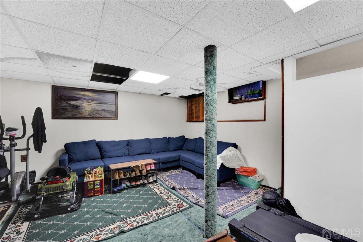 145 Jefferson Boulevard Edison, NJ 08817 - Photo 27 of 35 a living room with furniture and a window