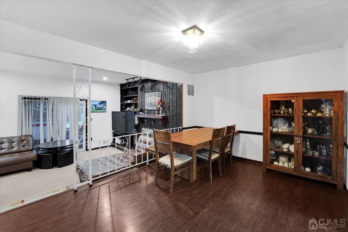145 Jefferson Boulevard Edison, NJ 08817 - Photo 8 of 35 a dining room with furniture and wooden floor