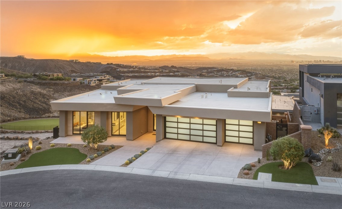 677 Overlook Rim Drive Henderson, NV 89012 - Photo 89 of 97 Bold geometric lines and flat-roof architecture frame panoramic mountain and valley vistas.