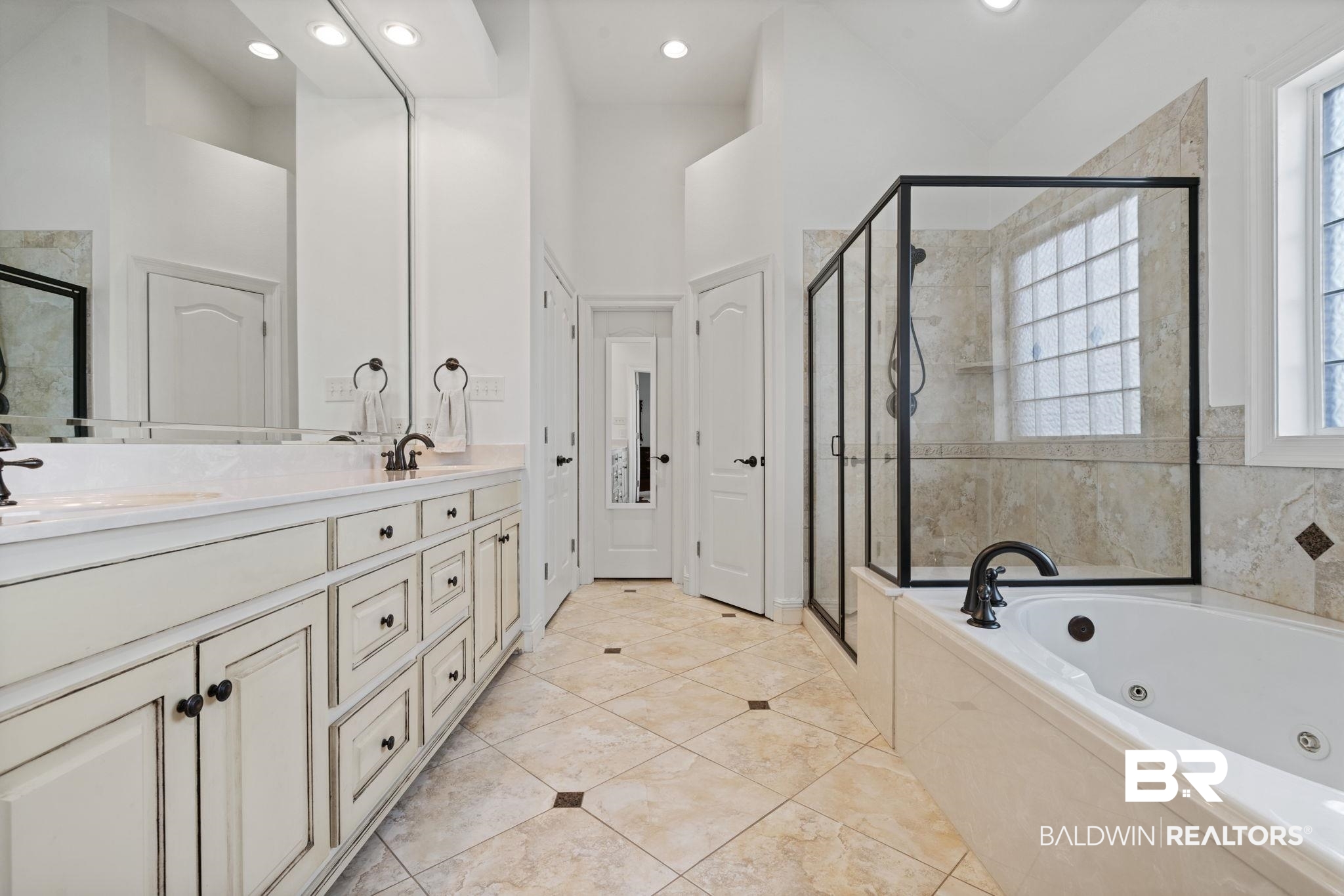 4771 Pecan Ridge East Mobile, AL 36619 - Photo 39 of 48 Bathroom featuring double vanity, a stall shower, a tub with jets, healthy amount of natural light, and recessed lighting